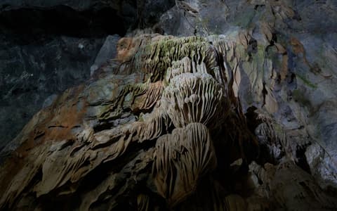 Stalactite and stalagmite formations inside a cave