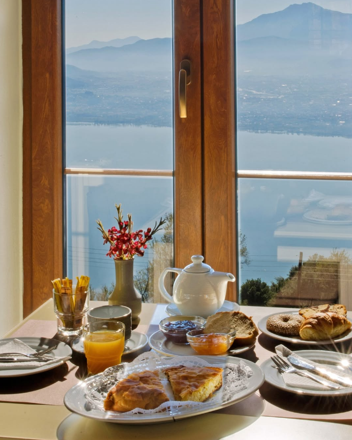 Traditional breakfast with lake view at Arktos Hotel